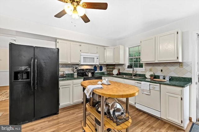 319 Fox Hunters Ln, Madison, VA 22727 - kitchen featuring black appliances, dark countertops, a ceiling fan, tasteful backsplash, and light wood finished floors