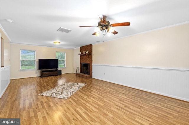 319 Fox Hunters Ln, Madison, VA 22727 - unfurnished living room with wood finished floors, ornamental molding, a ceiling fan, a fireplace, and wainscoting