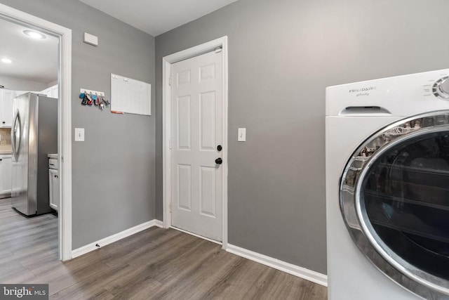 7221 Crockett Ave, Rapidan, VA 22733 - laundry area with washer / clothes dryer, wood finished floors, and baseboards