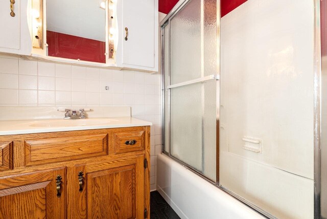 340 New York Ave, Harrisonburg, VA 22801 - bathroom with vanity, enclosed tub / shower combo, and tasteful backsplash