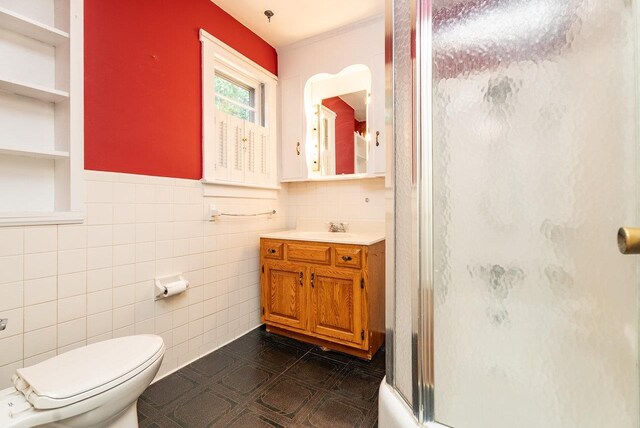340 New York Ave, Harrisonburg, VA 22801 - bathroom featuring a shower with door, vanity, and tile walls
