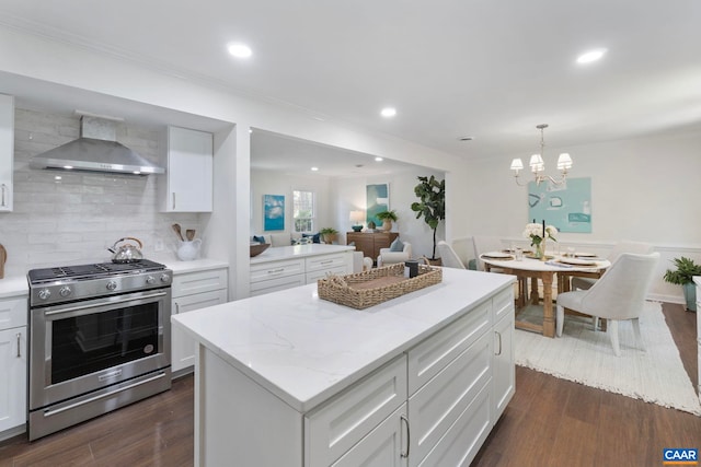 102 Powhatan Cir, Charlottesville, VA 22901 - kitchen with wall chimney exhaust hood, gas stove, backsplash, dark wood finished floors, and white cabinets