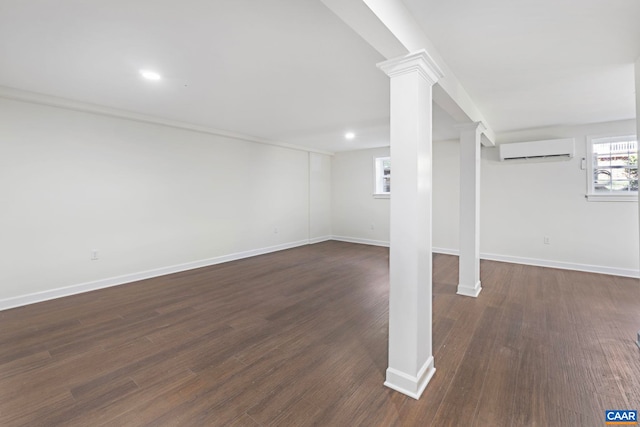 102 Powhatan Cir, Charlottesville, VA 22901 - basement with a wall unit AC, baseboards, dark wood finished floors, and recessed lighting