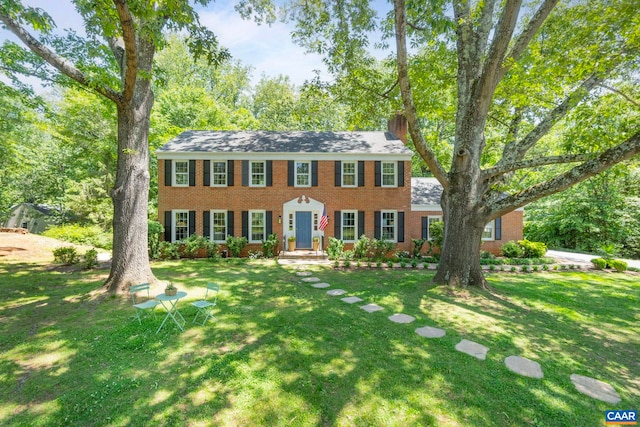 102 Powhatan Cir, Charlottesville, VA 22901 - colonial home with brick siding and a front yard
