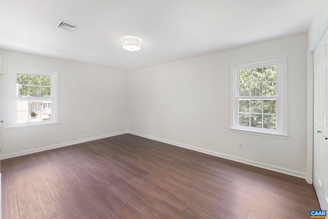 102 Powhatan Cir, Charlottesville, VA 22901 - spare room featuring dark wood-style floors and baseboards