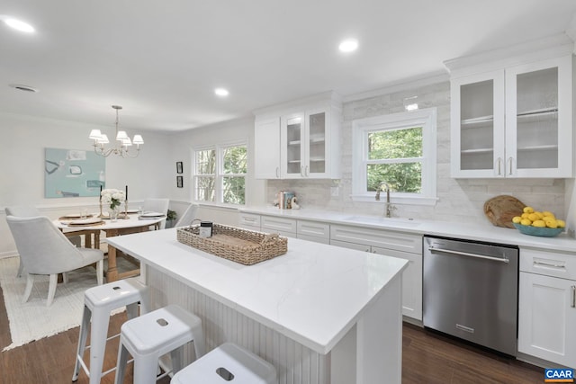102 Powhatan Cir, Charlottesville, VA 22901 - kitchen with dishwasher, a sink, white cabinetry, backsplash, and crown molding