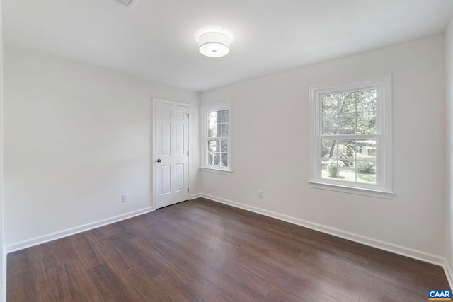 102 Powhatan Cir, Charlottesville, VA 22901 - empty room featuring healthy amount of natural light, dark wood finished floors, and baseboards