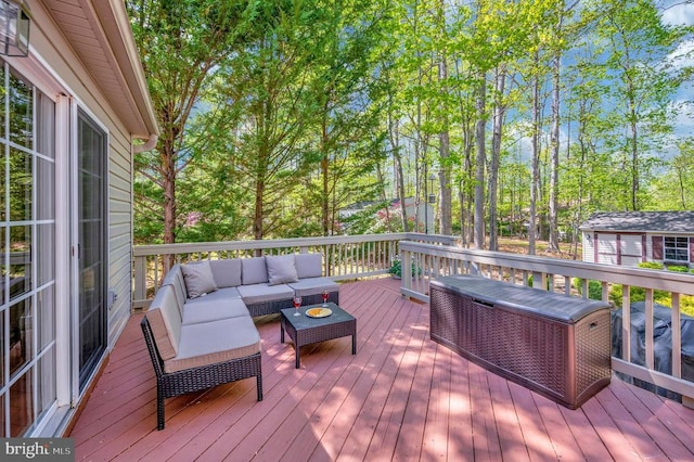 wooden terrace featuring an outdoor living space