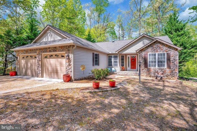 ranch-style home featuring stone siding, an attached garage, driveway, and roof with shingles