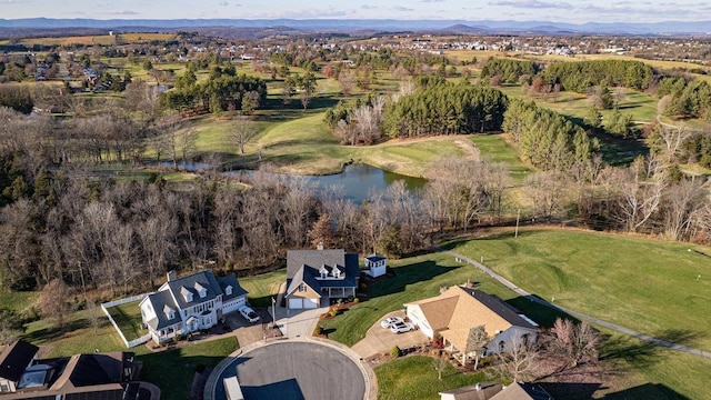 birds eye view of property featuring a water and mountain view and a residential view