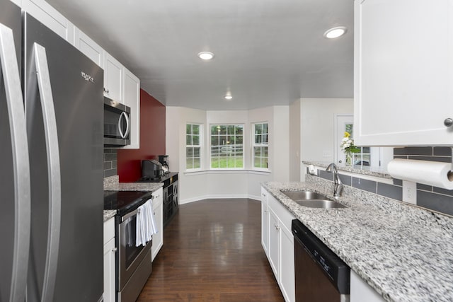 10 Zephyr Rd, Palmyra, VA 22963 - kitchen featuring appliances with stainless steel finishes, a sink, tasteful backsplash, white cabinetry, and recessed lighting