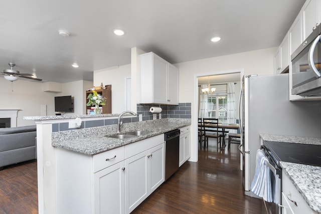 10 Zephyr Rd, Palmyra, VA 22963 - kitchen with appliances with stainless steel finishes, a sink, open floor plan, a ceiling fan, and dark wood-type flooring