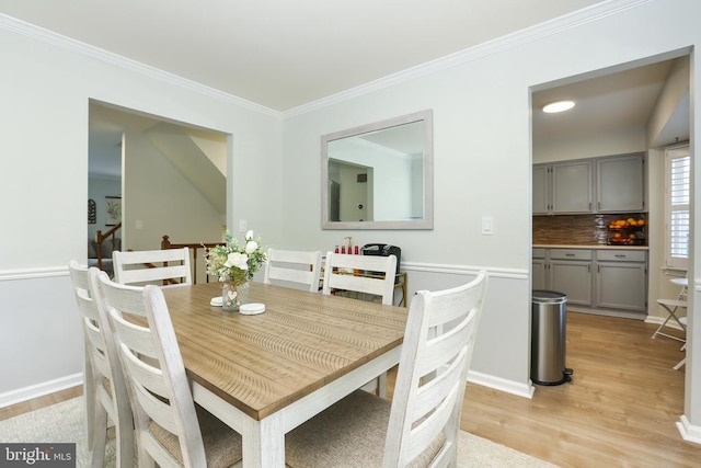 769 Cherry Tree Ln, Warrenton, VA 20186 - dining area featuring light wood finished floors and ornamental molding