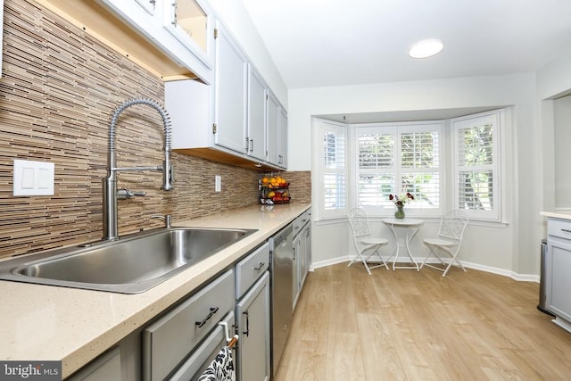 769 Cherry Tree Ln, Warrenton, VA 20186 - kitchen featuring dishwasher, tasteful backsplash, light wood-type flooring, and gray cabinetry