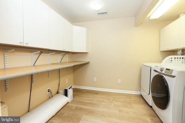 769 Cherry Tree Ln, Warrenton, VA 20186 - washroom with cabinet space, washer and dryer, and light wood-style floors