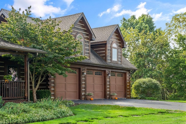 945 Neese Ln, New Market, VA 22844 - view of front facade with an attached garage, a front lawn, and log exterior