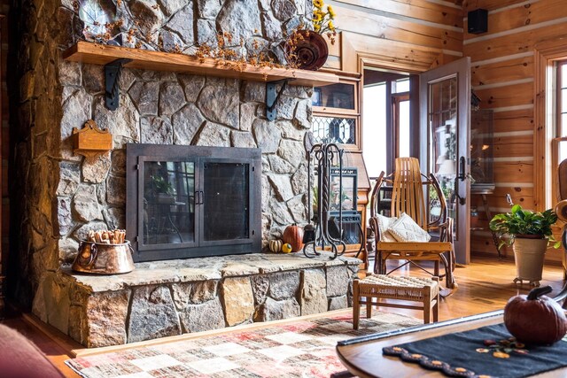 945 Neese Ln, New Market, VA 22844 - living room with wood finished floors, wooden walls, and a fireplace