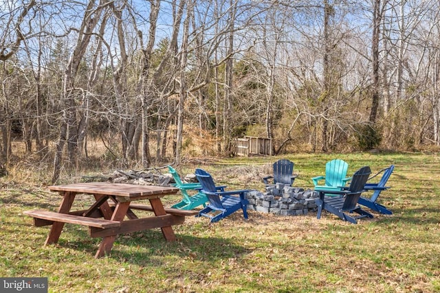 view of yard with a fire pit