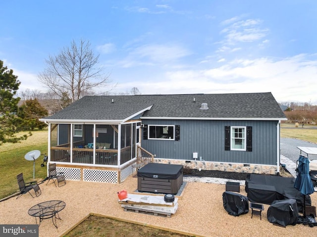 rear view of house featuring a patio, a shingled roof, a sunroom, crawl space, and a hot tub