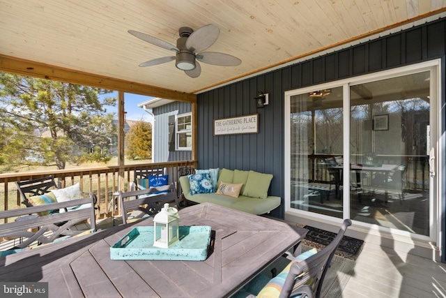 wooden terrace featuring a ceiling fan and outdoor lounge area