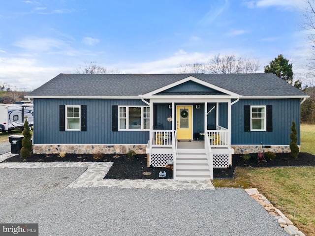 view of front of home featuring a porch, crawl space, and a shingled roof