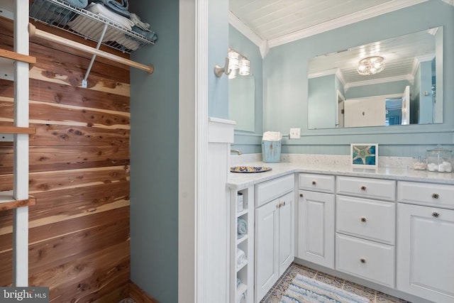 bathroom with crown molding and vanity