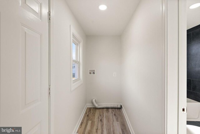 laundry area featuring washer hookup, recessed lighting, wood finished floors, laundry area, and baseboards