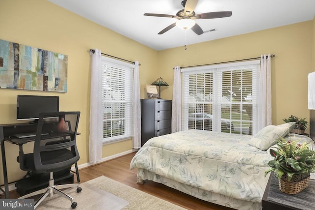 12006 Meadow Branch Way, Fredericksburg, VA 22407 - bedroom with wood finished floors, an office area, and a ceiling fan