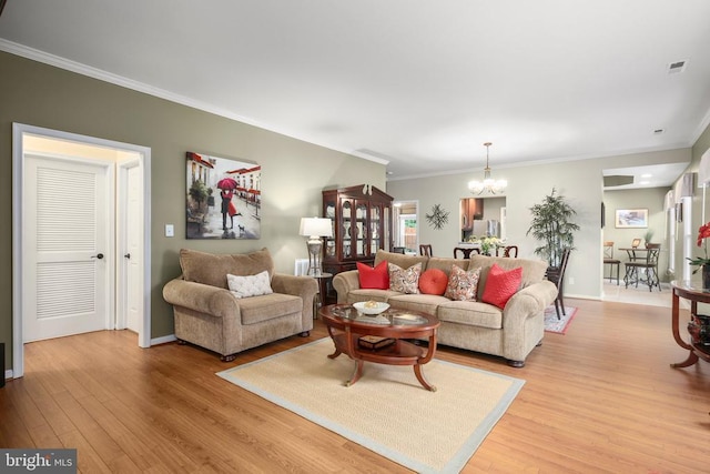 12006 Meadow Branch Way, Fredericksburg, VA 22407 - living area featuring a chandelier, light wood-style floors, and ornamental molding