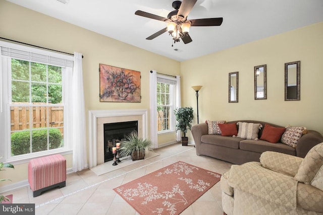 12006 Meadow Branch Way, Fredericksburg, VA 22407 - living room with tile patterned floors, ceiling fan, and a fireplace with flush hearth