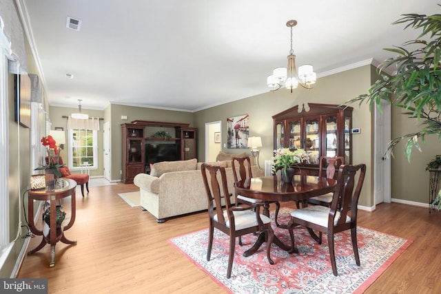 12006 Meadow Branch Way, Fredericksburg, VA 22407 - dining room featuring a chandelier, light wood-style flooring, and ornamental molding