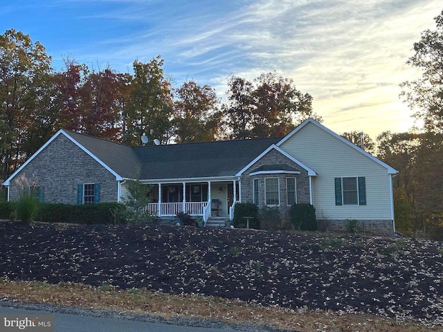 5519 Bazzanella Dr, Mineral, VA 23117 - ranch-style home featuring a porch and stone siding