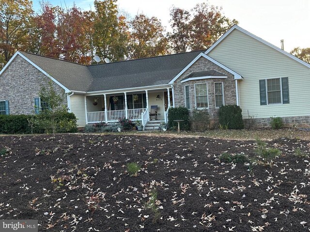 5519 Bazzanella Dr, Mineral, VA 23117 - single story home with a porch and stone siding