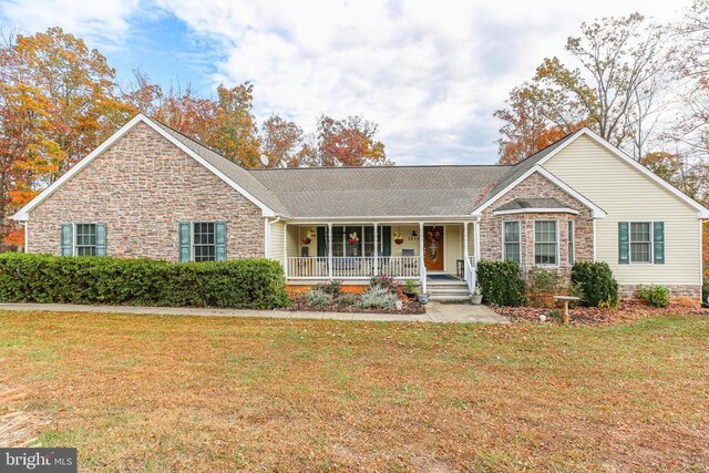5519 Bazzanella Dr, Mineral, VA 23117 - ranch-style house featuring stone siding, covered porch, and a front lawn