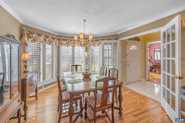 4267 Buck Island Rd, Charlottesville, VA 22902 - dining room with a chandelier, crown molding, light wood finished floors, and french doors
