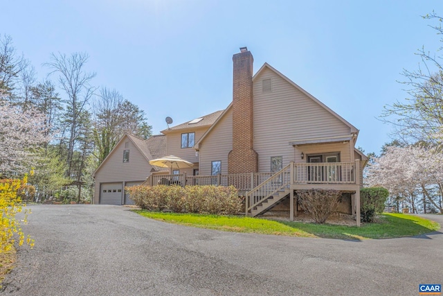 4267 Buck Island Rd, Charlottesville, VA 22902 - view of home's exterior with a chimney, an outbuilding, a deck, and stairway