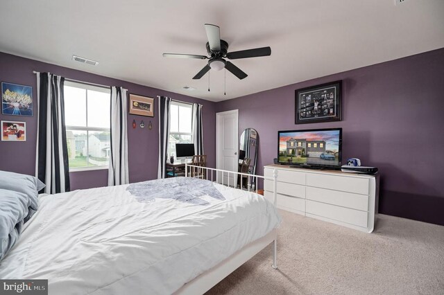 bedroom with carpet floors and a ceiling fan