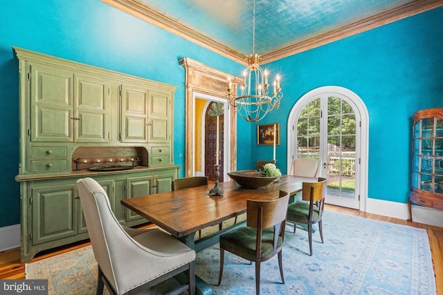 8833 Wales Rd N, Warrenton, VA 20186 - dining room with a chandelier, light wood finished floors, and ornamental molding