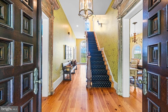 8833 Wales Rd N, Warrenton, VA 20186 - foyer with stairway, a chandelier, wood finished floors, and a towering ceiling