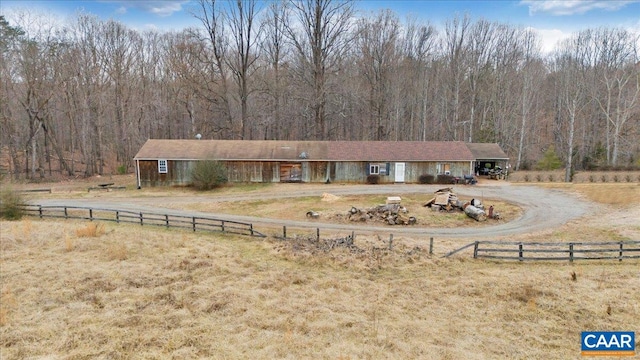 2420 James River Rd, Esmont, VA 22937 - view of front of house featuring driveway, a forest view, and fence