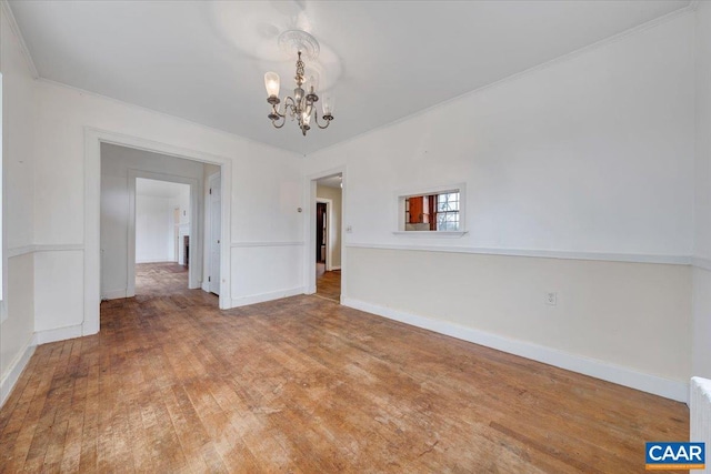 2420 James River Rd, Esmont, VA 22937 - unfurnished dining area with a notable chandelier, baseboards, and wood finished floors