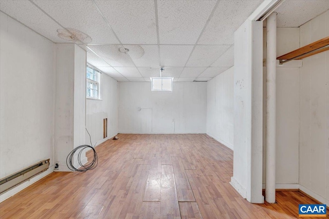 2420 James River Rd, Esmont, VA 22937 - basement featuring a paneled ceiling, baseboard heating, and wood finished floors