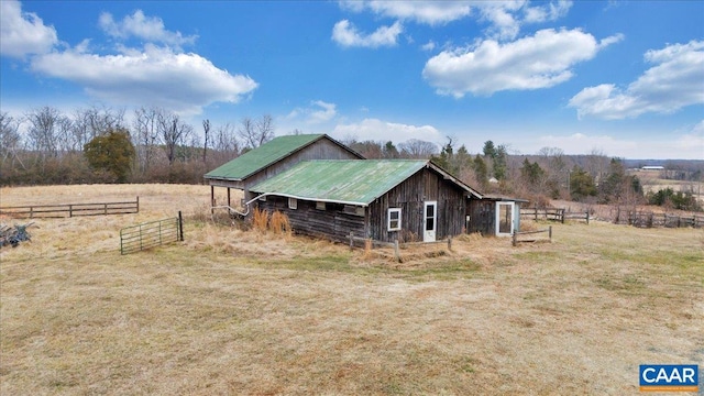2420 James River Rd, Esmont, VA 22937 - exterior space with a rural view, an outbuilding, metal roof, and fence