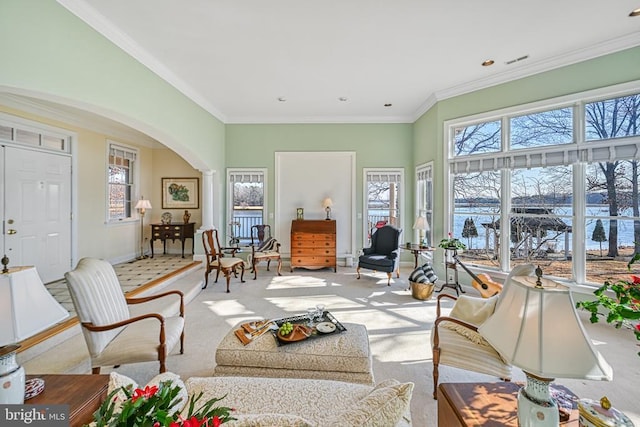 175 Covenant Way, Bumpass, VA 23024 - living room featuring arched walkways, light carpet, and crown molding
