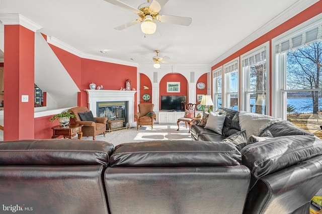175 Covenant Way, Bumpass, VA 23024 - carpeted living area featuring ceiling fan, a glass covered fireplace, crown molding, and arched walkways