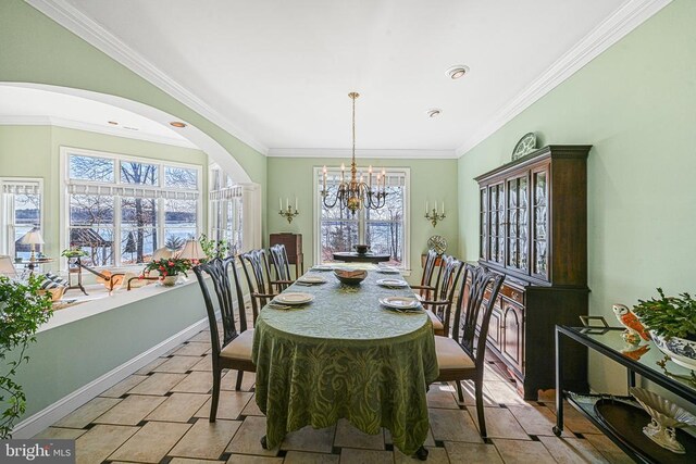 175 Covenant Way, Bumpass, VA 23024 - dining space with plenty of natural light, arched walkways, ornamental molding, and a chandelier