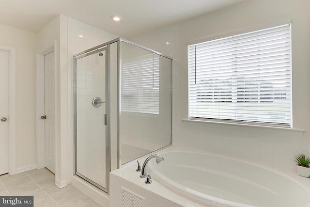 2020 Captain Dr, Fredericksburg, VA 22408 - bathroom featuring tile patterned floors, a shower stall, and a bath
