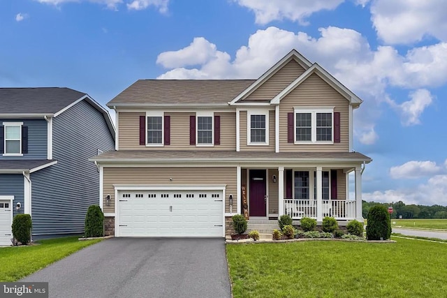 2020 Captain Dr, Fredericksburg, VA 22408 - traditional home featuring a porch, a garage, driveway, a front yard, and stone siding