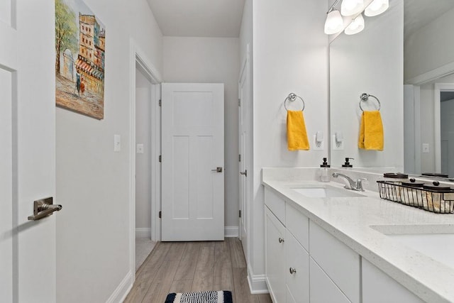 120 Ridgeline Dr, Waynesboro, VA 22980 - bathroom with double vanity, wood finished floors, and baseboards