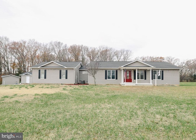  - ranch-style home featuring a front yard and a shingled roof